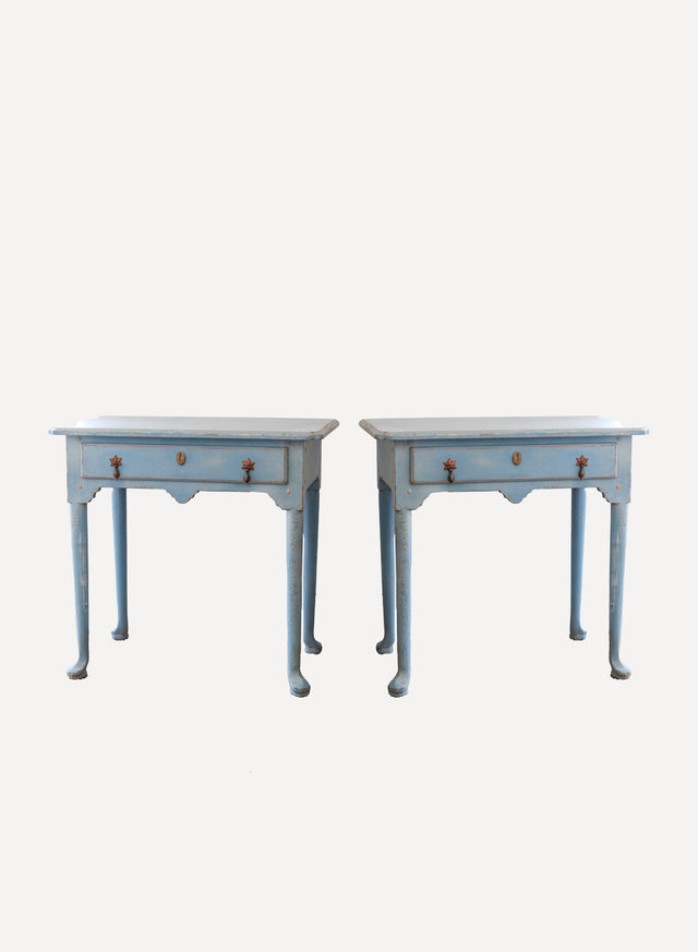 An antique pair of french blue painted timber nightstands with single drawers, cabriole legs and small brass pull handles. These tables are antiques and in good condition with some slight wear and tear consistent with age.